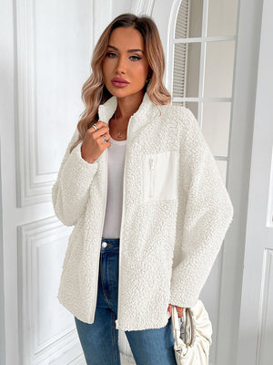 White teddy fleece jacket with zip front and patch pocket detail.