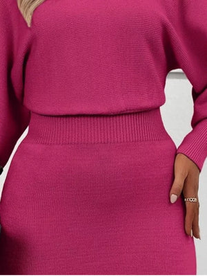 Rose red acrylic sweater dress with dramatic lantern sleeves and a ribbed waistband.