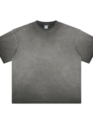 Washed black oversized t-shirt with distressed neckline and raw hem.