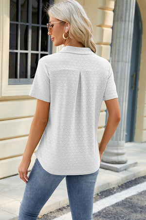 White textured polo shirt with V-neck detail and short sleeves.
