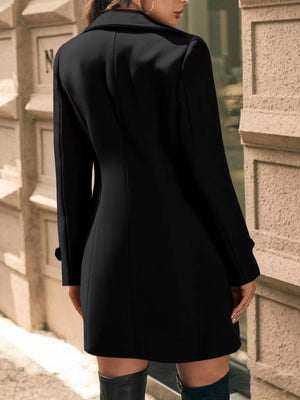 Black double-breasted wool blend trench coat with cuffed sleeves and a-line cut.