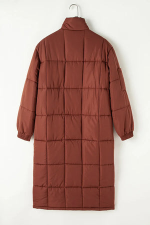 Brown quilted longline puffer coat with patch pockets and elastic cuffs.