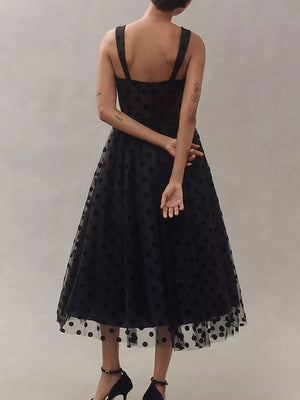 Black polka dot tulle dress with sweetheart neckline and spaghetti straps.