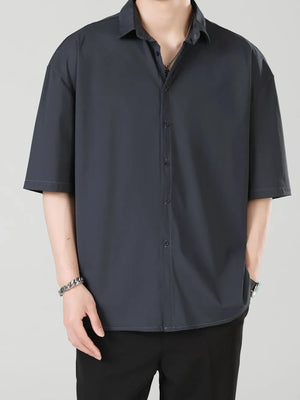 Men's dark gray short-sleeve button-down shirt with a relaxed fit.