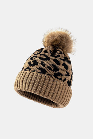 Textured leopard print acrylic beanie with a faux fur pom in khaki.