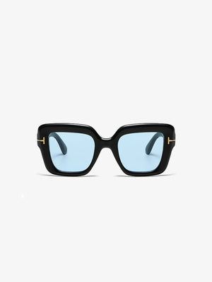 Black geometric acetate sunglasses with light blue tinted lenses and gold accents.