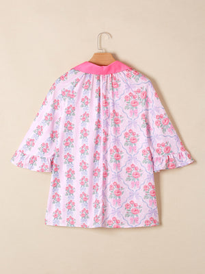 Pink floral and bow print maternity shirt with ruffled sleeves and pink collar.