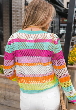 Rainbow crochet sweater with openwork knit and striped pattern in hot pink, gum leaf green, and white.
