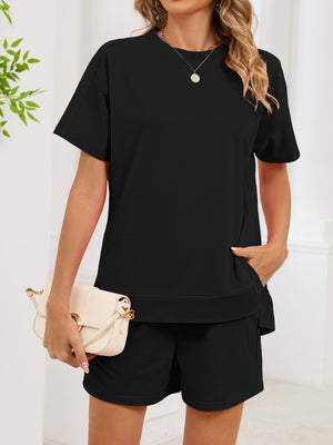 Black relaxed two-piece set with crew neck t-shirt and shorts, featuring pockets.