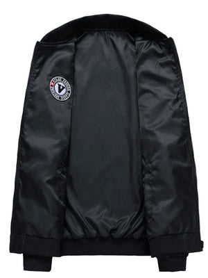 Black bomber jacket with satin lining and embroidered patch detail.