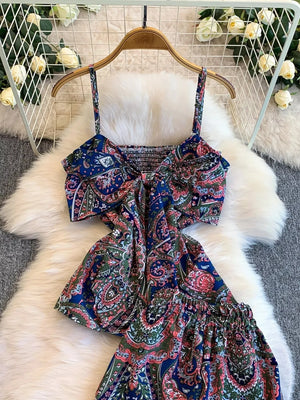 Chic cami and wide-leg pant set in Royal Blue paisley print with smocked bodice and tie detail.