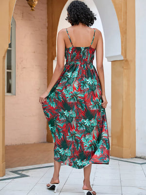 Chic floral midi dress with spaghetti straps in red and green tropical print.
