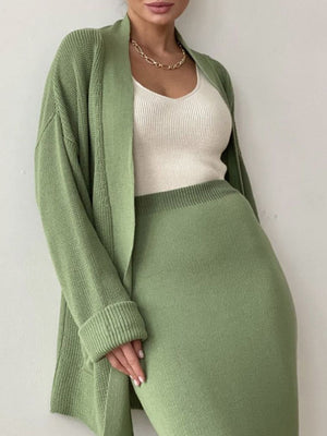 Ribbed knit co-ord set in Gum Leaf green with a long cardigan and midi skirt.