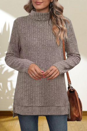 Ribbed knit turtleneck tunic top in Heather Gray with side slits, styled with jeans and a brown bag.