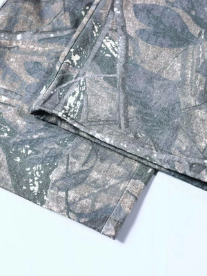 Men's camouflage cargo sweatpants with a grey and green leaf pattern.