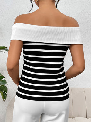 Off-shoulder knit top with black and white stripes and a white ribbed neckline.