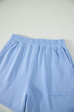 Light blue pocketed shorts with elastic waistband and contrast trim