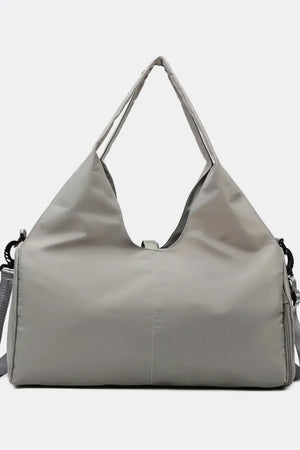 Gray duffel bag with dual top handles and detachable shoulder strap.