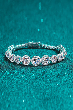 Silver moissanite tennis bracelet with oval halo stones