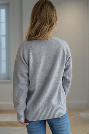 Gray speckled Donegal turtleneck pullover sweater with ribbed cuffs and hem.