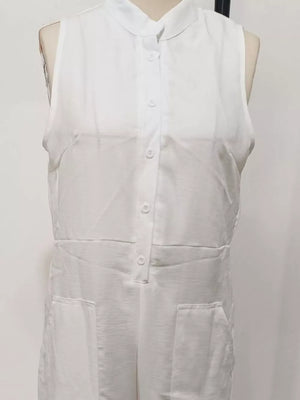 White sleeveless button-down romper with collar and pockets