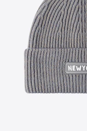 Gray ribbed acrylic beanie with a New York patch detail