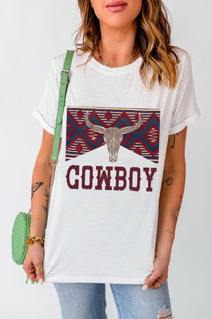 White t-shirt with a cowboy bull skull graphic and distressed "COWBOY" text.