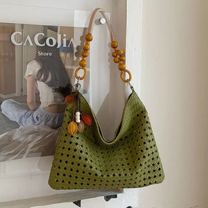 Cutout Shoulder Bag With Beaded Handle in Green, model styling view