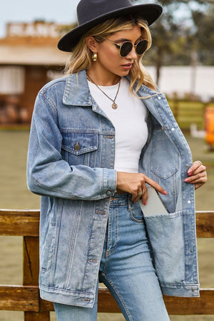 Oversized denim trucker jacket in medium wash with classic buttoned front and chest pockets.
