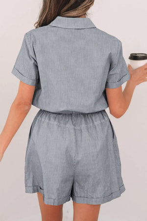 Pinstripe shirred waist romper with short sleeves and cuffed hem shorts.
