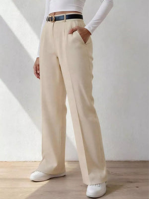 Beige wide-leg dress pants with pockets and belt loops, styled with a black belt.