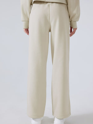 Beige relaxed fit palazzo sweatpants with drawstring waist and wide leg