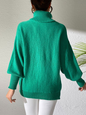 Green turtleneck sweater with dolman sleeves and ribbed cuffs and hem