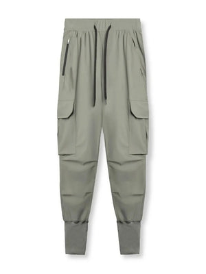 Sage technical cargo joggers with zip pockets and ribbed cuffs