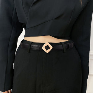 Black leather belt with a gold geometric buckle