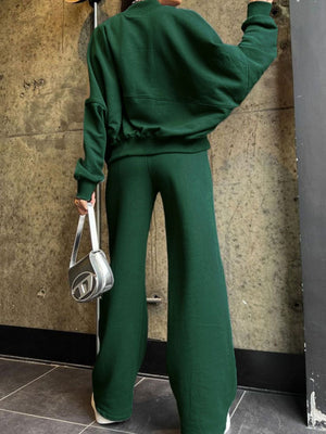 Dark green zip-up coord set with wide-leg pants and a cropped sweatshirt.