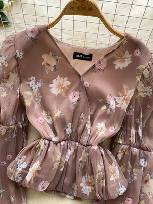Brown floral chiffon blouse with V-neck and balloon sleeves.