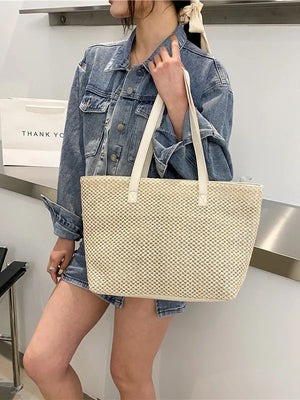 Textured straw shopper bag in beige with white leather straps.