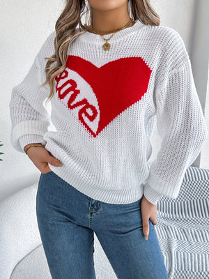 White knit sweater with red heart and love graphic, crew neck, long sleeves.