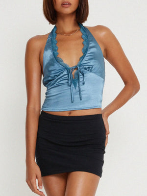 Light blue satin halter tie top with lace trim and tie front detail.