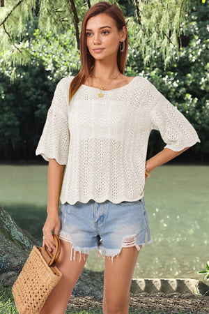 Cream open-knit top with scalloped sleeves and hem, boat neck, and relaxed fit.