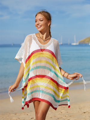 Rainbow stripe crochet beach poncho with V-neck and tassel ties.