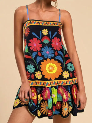 Black mini dress with vibrant floral print, square neckline, and spaghetti straps.
