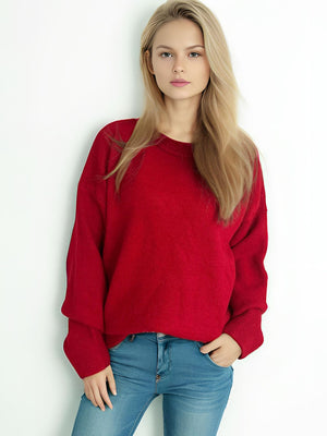 Oversized red crewneck knit pullover sweater with ribbed cuffs and hem.
