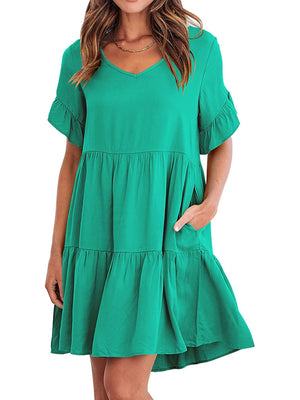 Emerald green tiered mini dress with ruffled sleeves and pockets