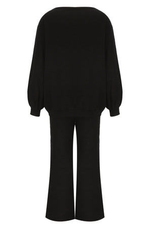 Black loungewear set with balloon sleeves and wide-leg pants.
