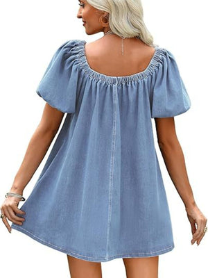 Light blue denim off-shoulder mini dress with puff sleeves and a gathered neckline.