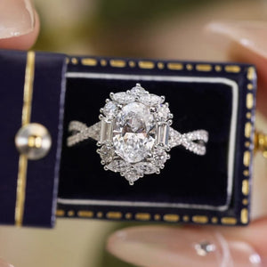 Sterling silver moissanite halo ring with oval center stone and baguette accents