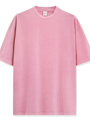 Oversized pink pigment-dyed crewneck t-shirt with short sleeves and a relaxed fit.