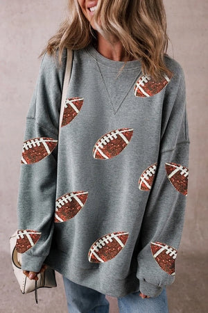 Dark gray sweatshirt with all-over football sequin embellishments and a crew neck.